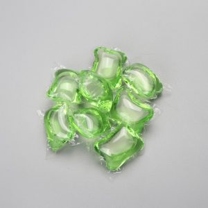 Green laundry detergent capsule