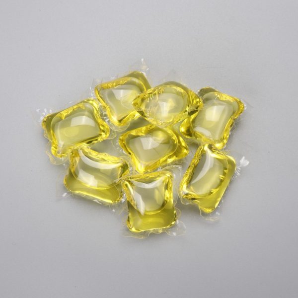 Yellow laundry detergent capsule