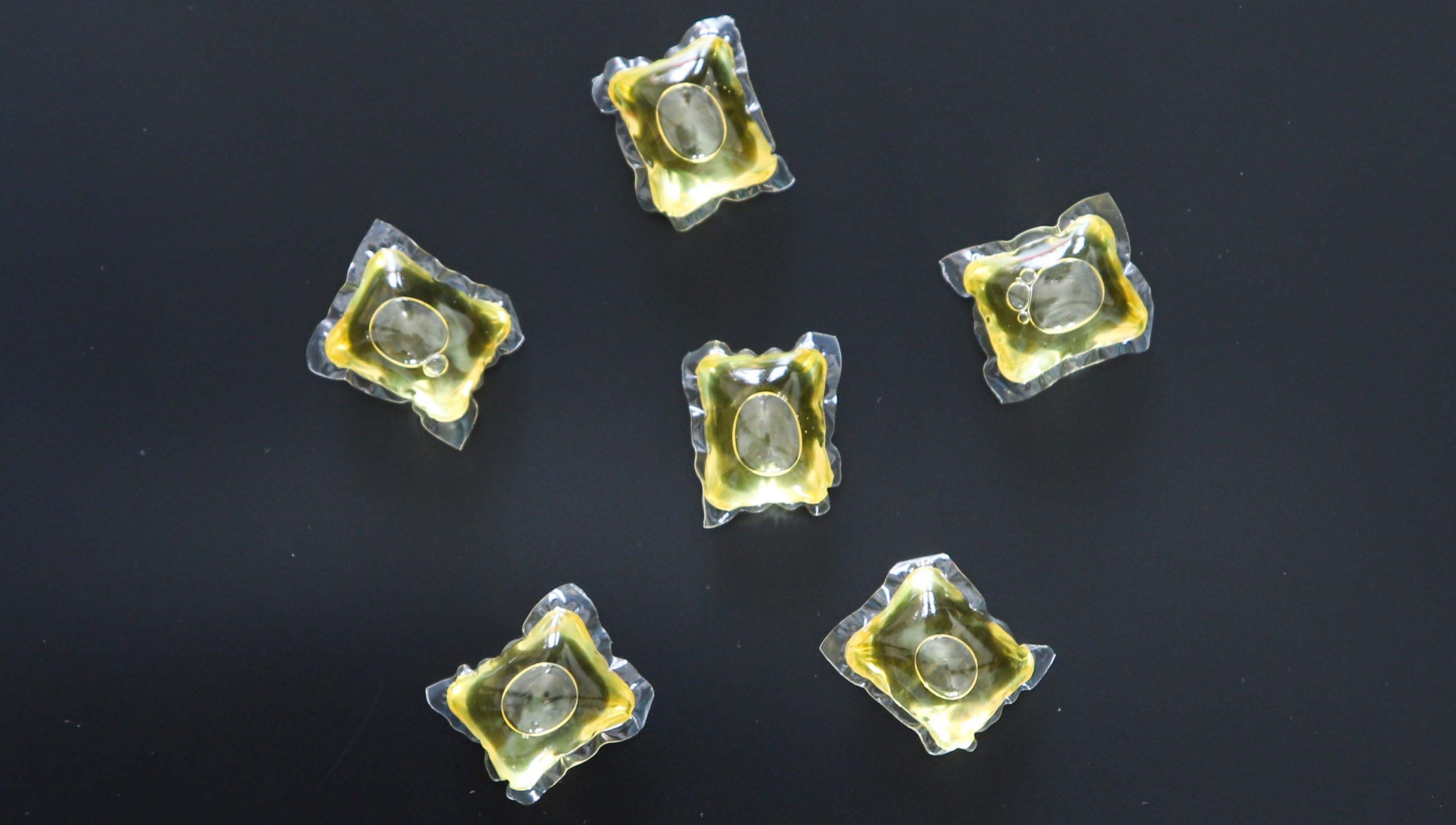 yellow laundry detergent capsules